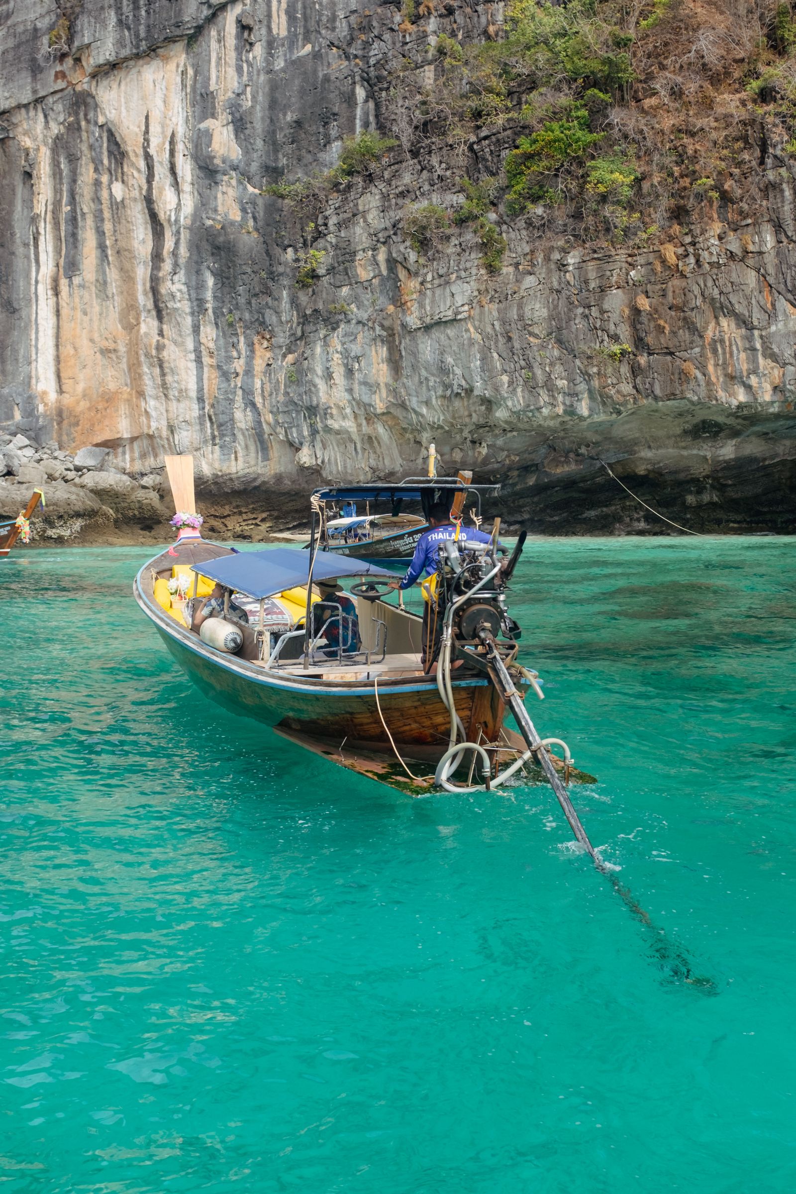 Traditional Thai longtail boat in turquoise water