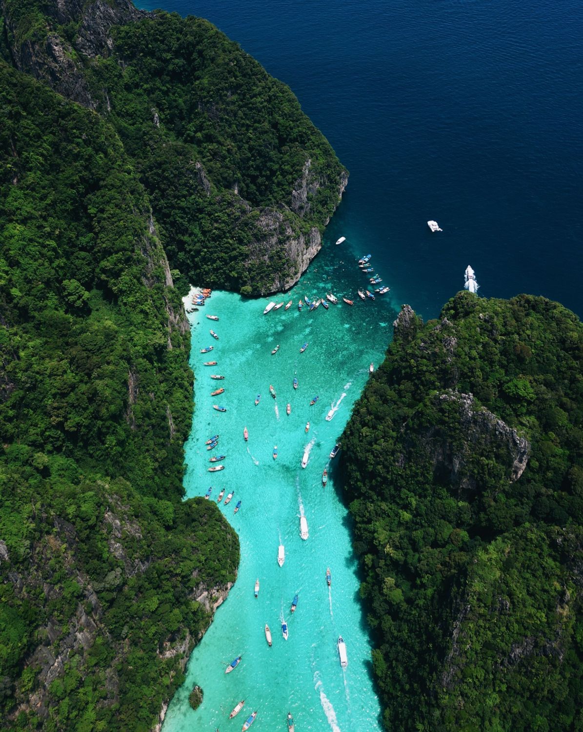 Aerial view of Pileh Lagoon's turquoise channel between limestone cliffs
