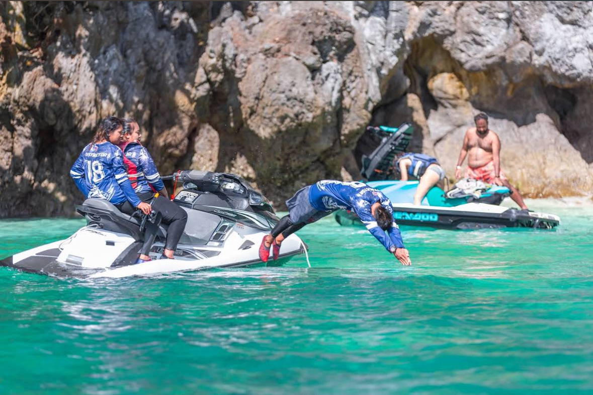 Customer diving off the jetski during the 9-Point swim break