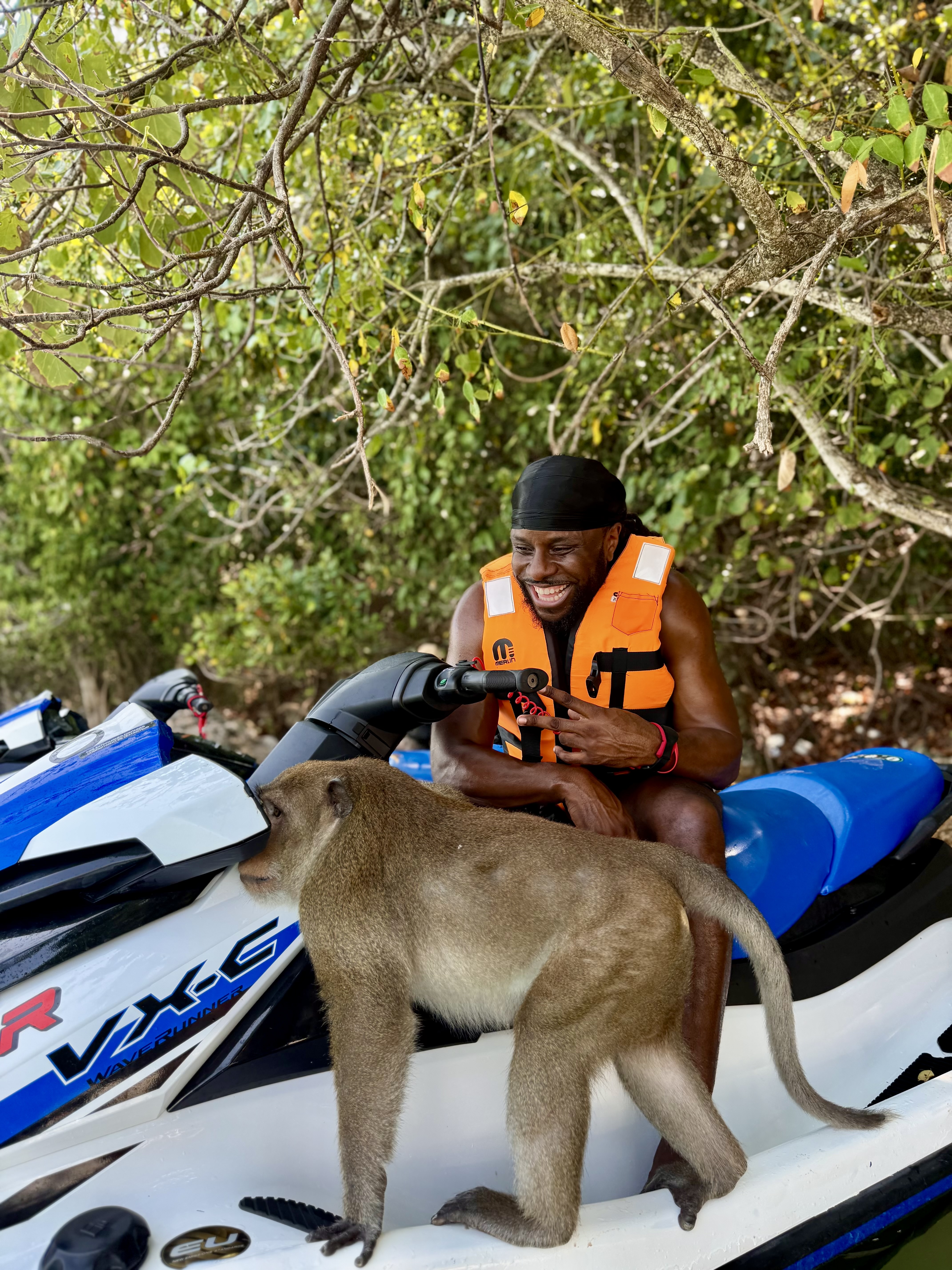 Customer with a monkey on the jetski at Monkey Island