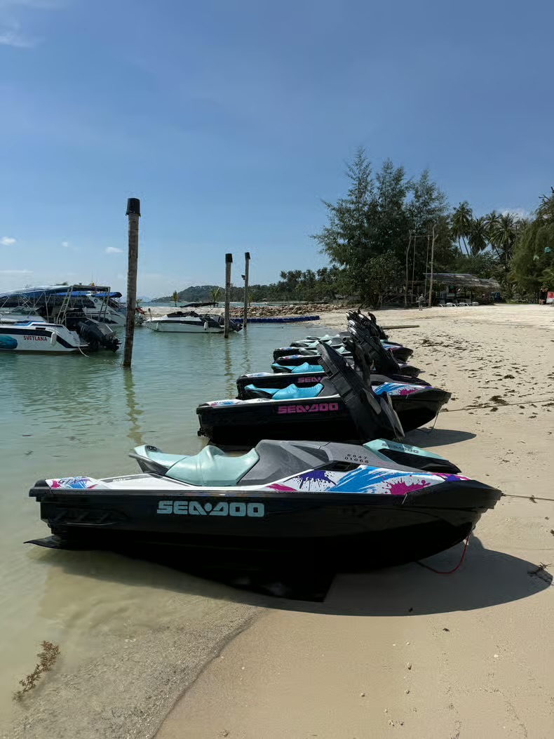 Row of Sea-Doos beached and ready at the launch point